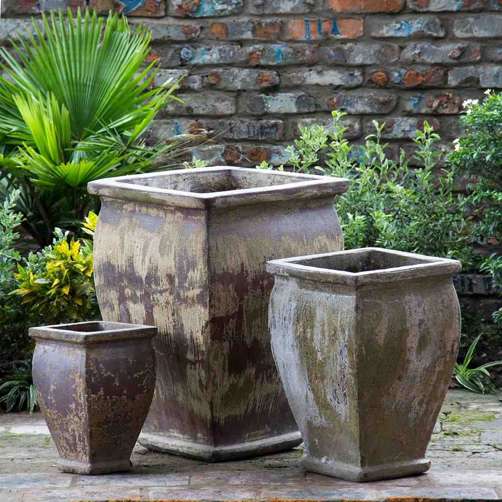 Flared square-rimmed ceramic planter featuring a distressed finish in brown, beige, and muted green, with a rustic, weathered look