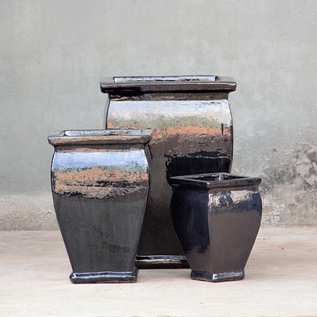 Flared square-rimmed ceramic planter with a sleek black glaze and smooth finish