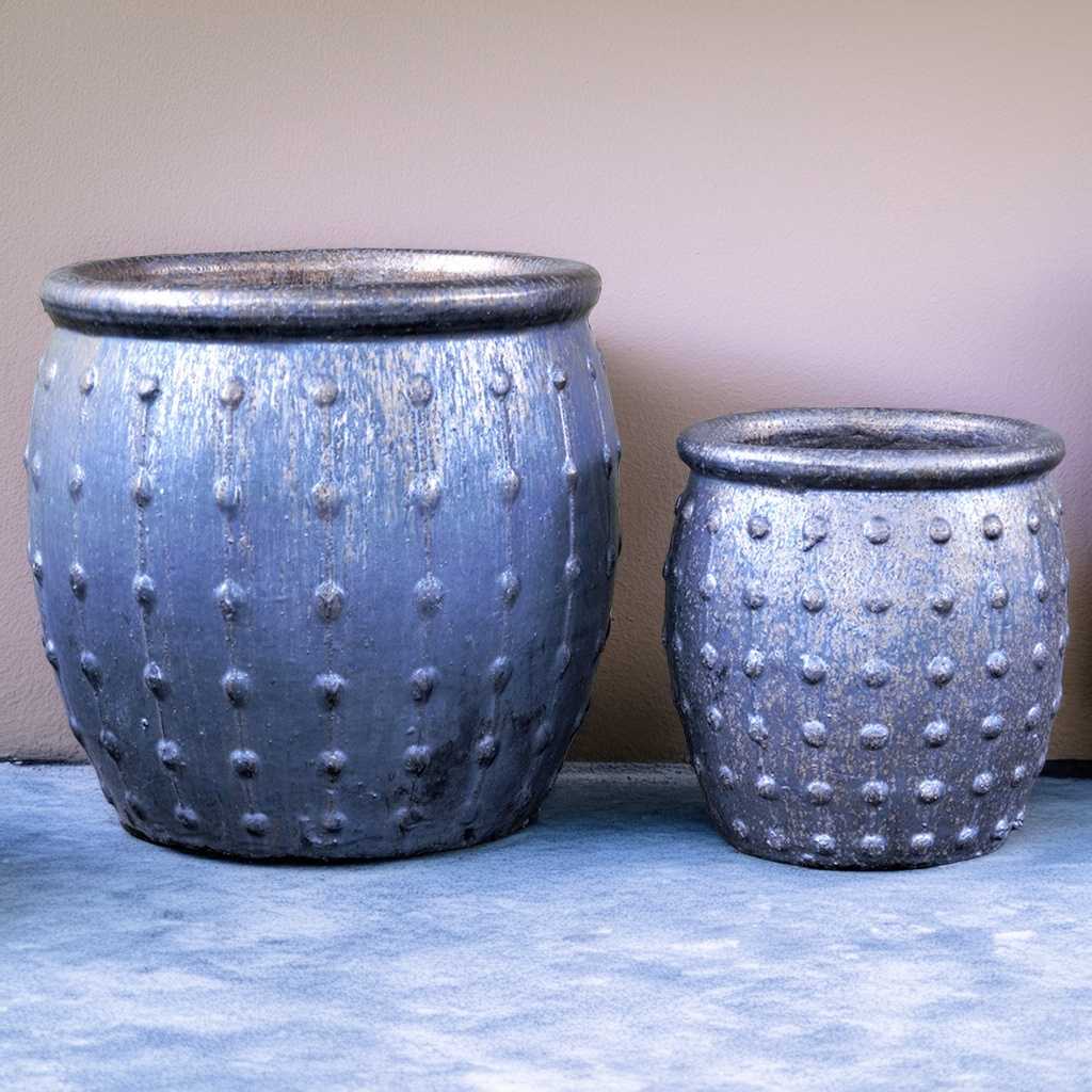 Rounded ceramic planters in matte silver with vertical dotted ridges