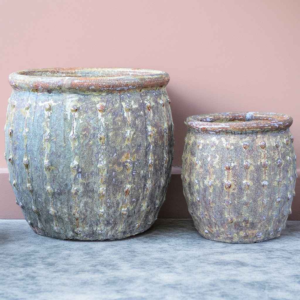 Rounded ceramic planters in weathered antique lime wash finish with vertical dotted ridges