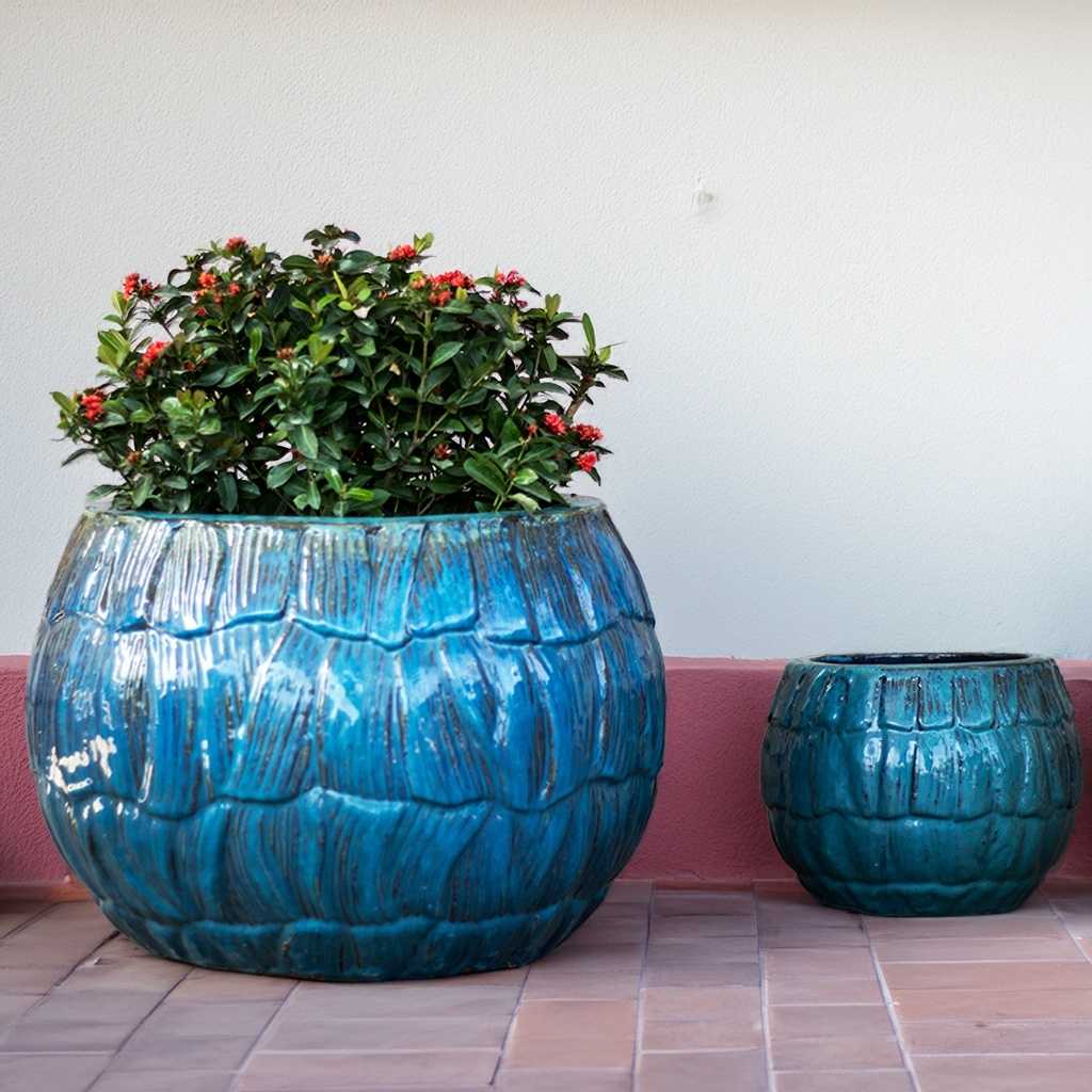Wholesale Bulbous ceramic planter with scallop texture and a glossy blue glaze