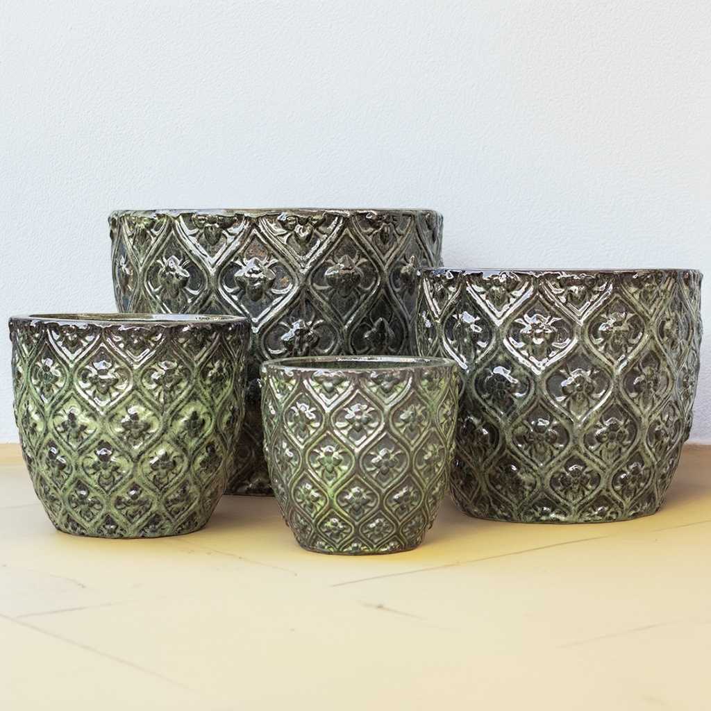 Metallic antique silver round planters featuring a raised floral lattice texture