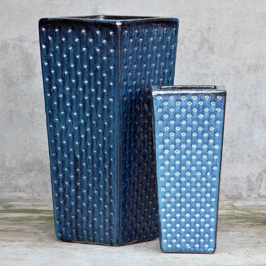 Square ceramic planter with dimpled texture in dark blue, accented by subtle black details