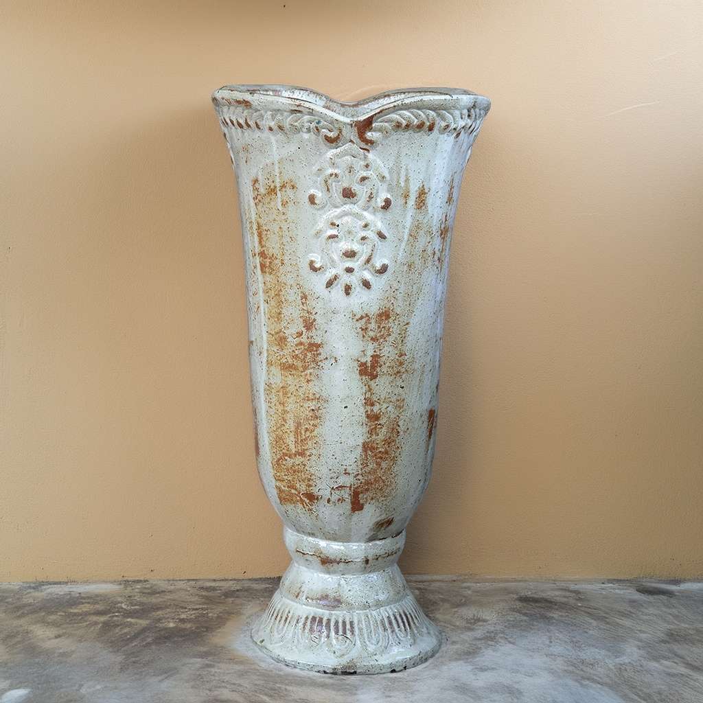 Glossy cream pedestal vase planter featuring an embossed flower design