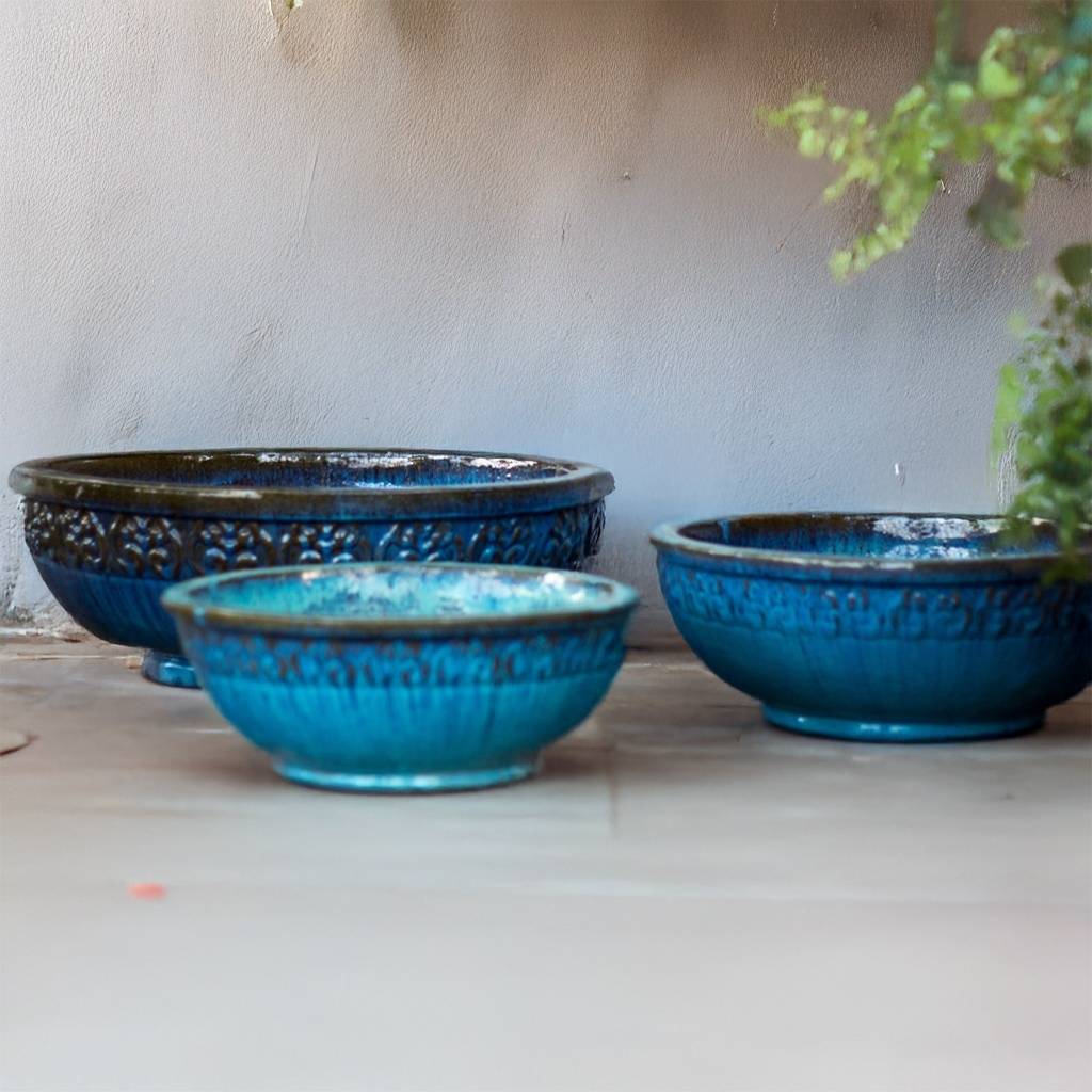 Elegant Scroll low bowl ceramic planter featuring a rich blue glaze with brown accents and intricate scroll detailing