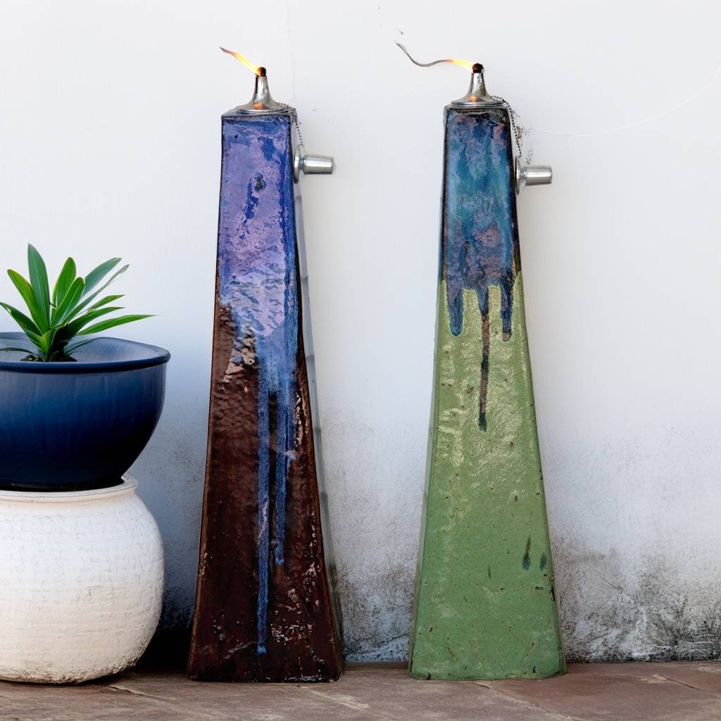 Two-toned inverted-pyramid ceramic oil lamp featuring a distressed brown and muted green base, accented with a dripping blue glaze for a rustic, artistic finish