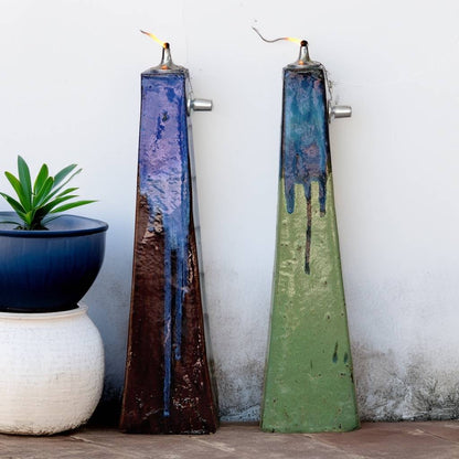 Two-toned inverted-pyramid ceramic oil lamp featuring a distressed brown and muted green base, accented with a dripping blue glaze for a rustic, artistic finish