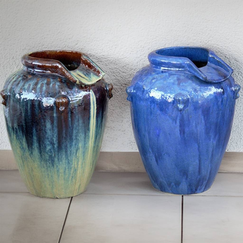 Glazed jar fountain featuring a unique offset rim design in blue and glazed blue-brown with a touch of yellow
