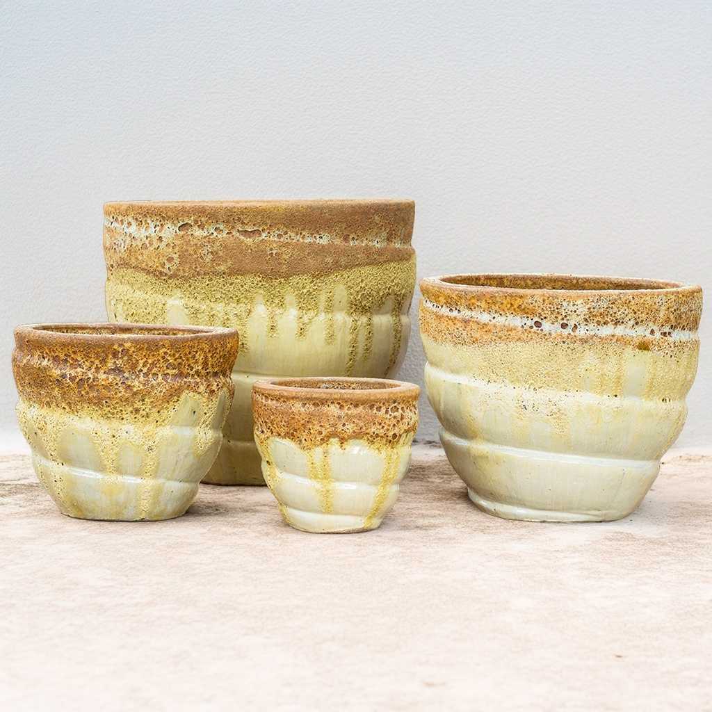 Triple color rounded spiral planters in shades of brown and yellow/cream with glazed finish