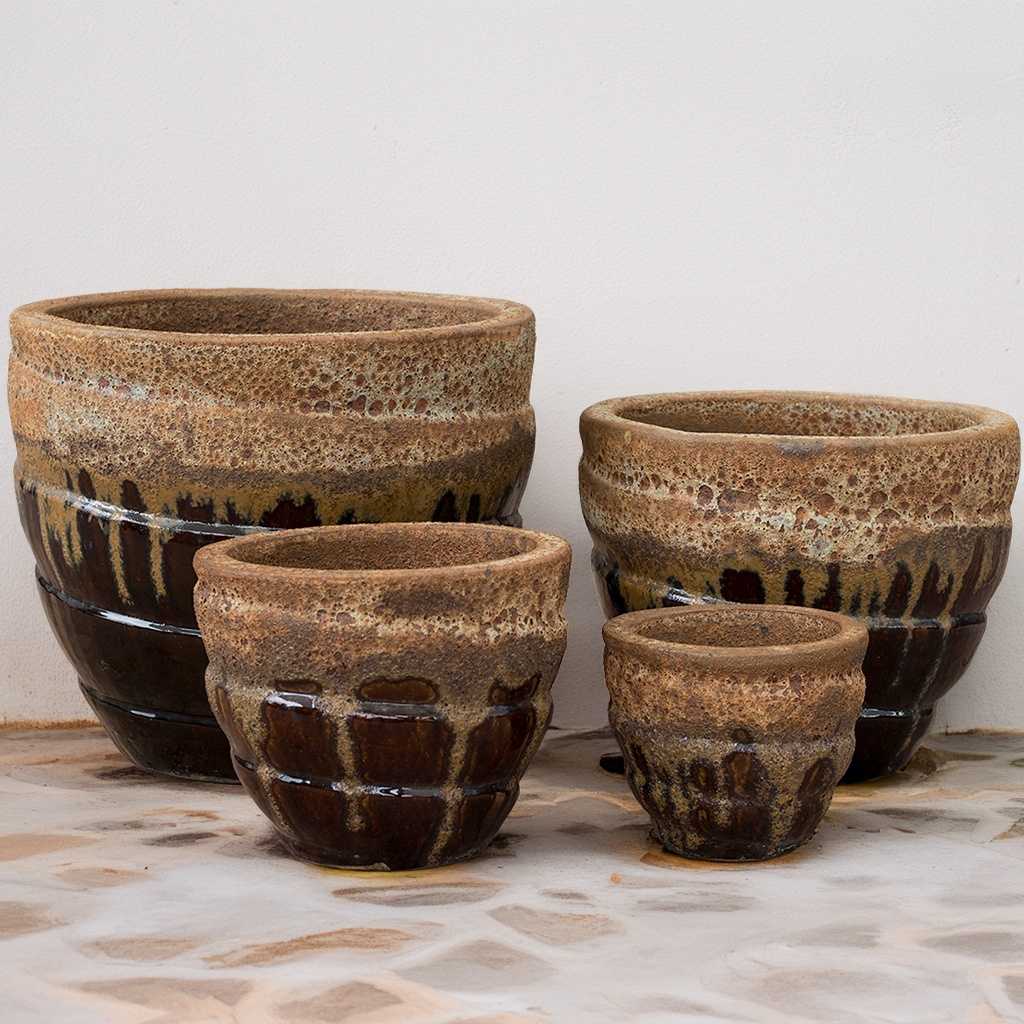 Rounded spiral planters in brown and cream/beige colors with fat lava effect