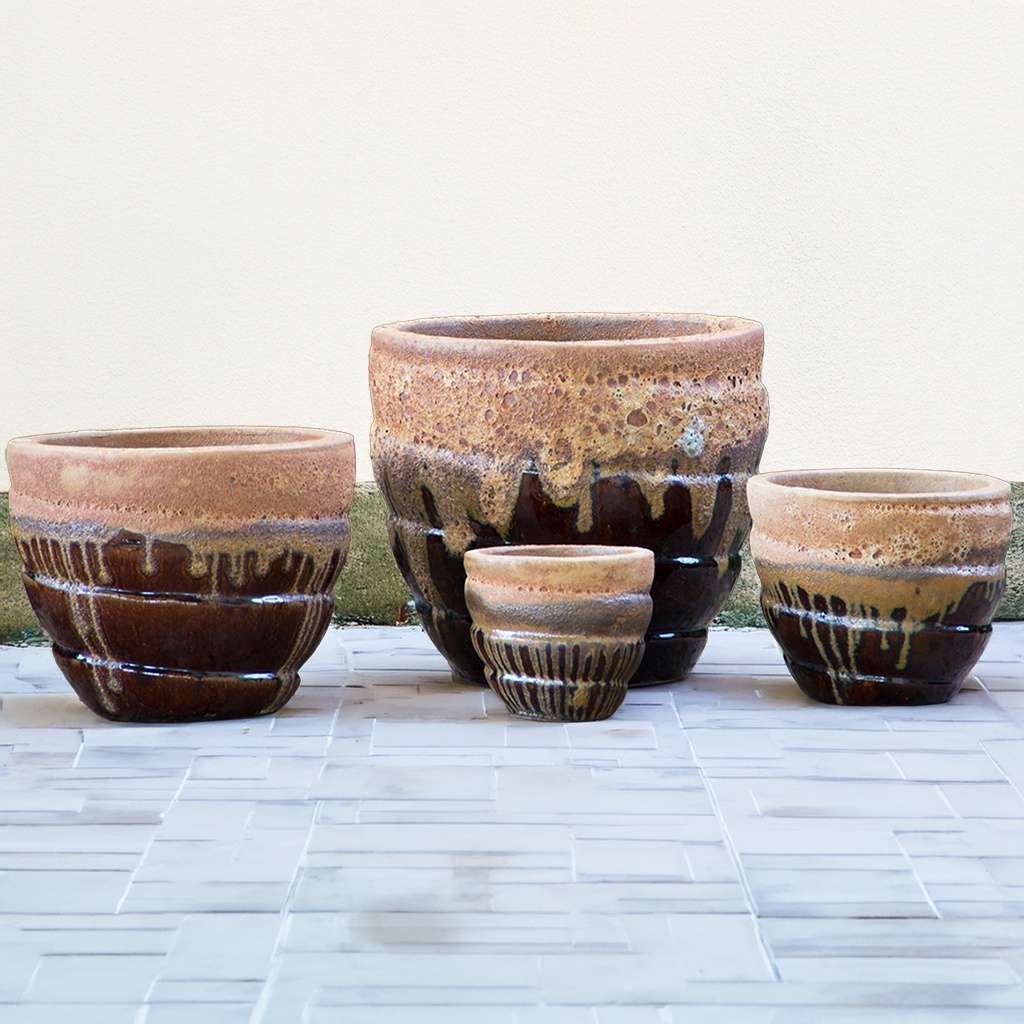 Rounded spiral planters in brown and cream/beige colors with fat lava effect