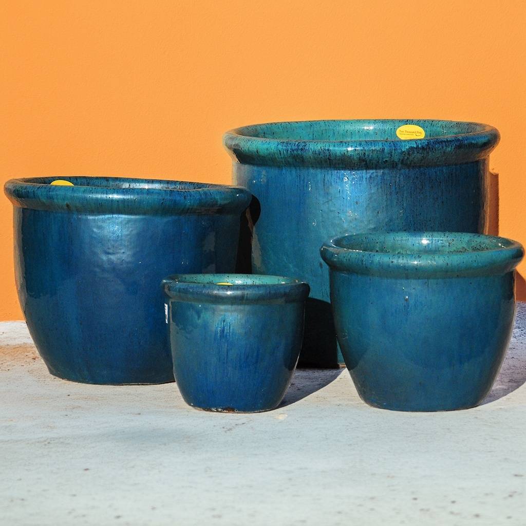 Set of 4 rounded ribbed wide rim pots in various sizes with glossy blue glazed finish