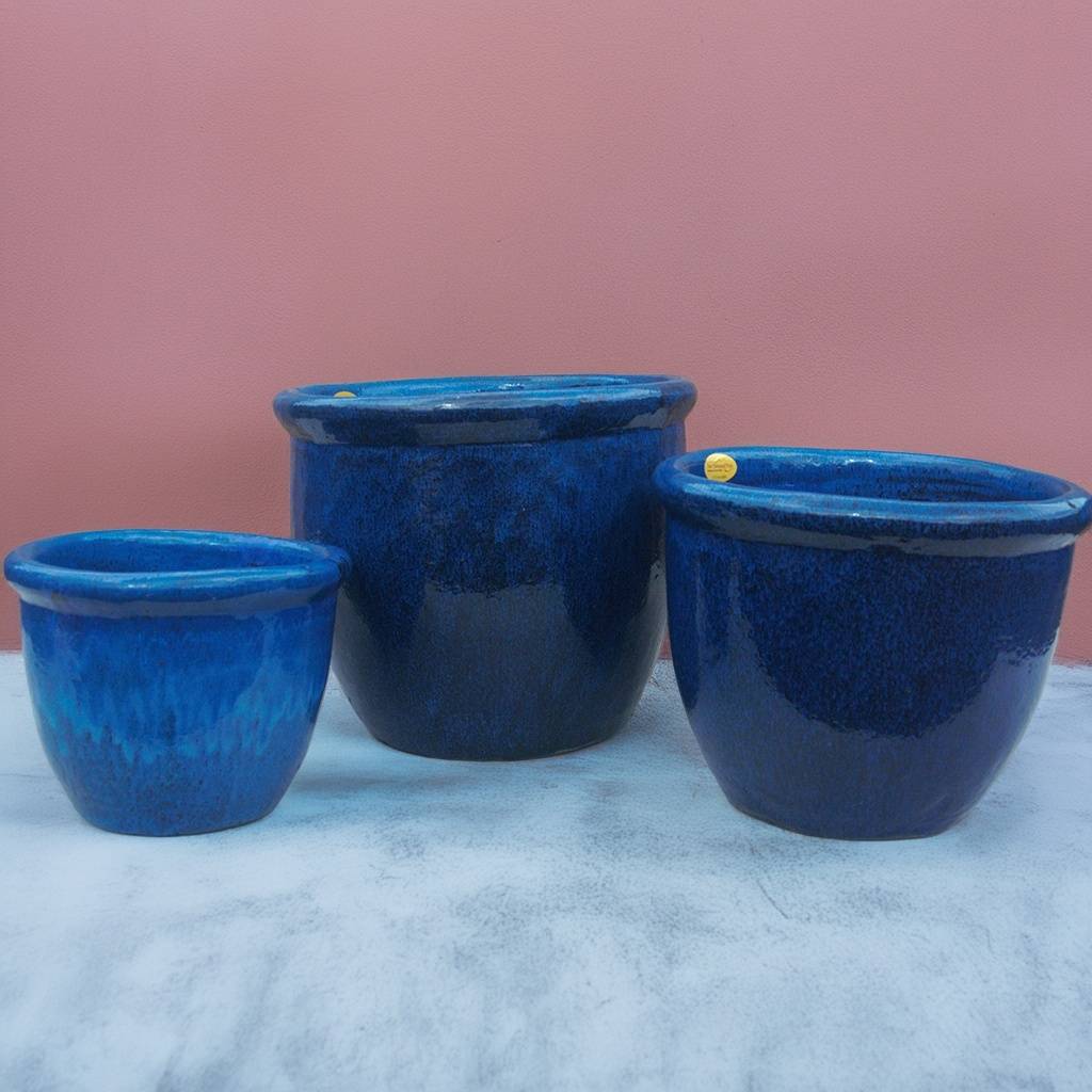 Set of 3 glossy blue rounded ribbed pots with wide rims