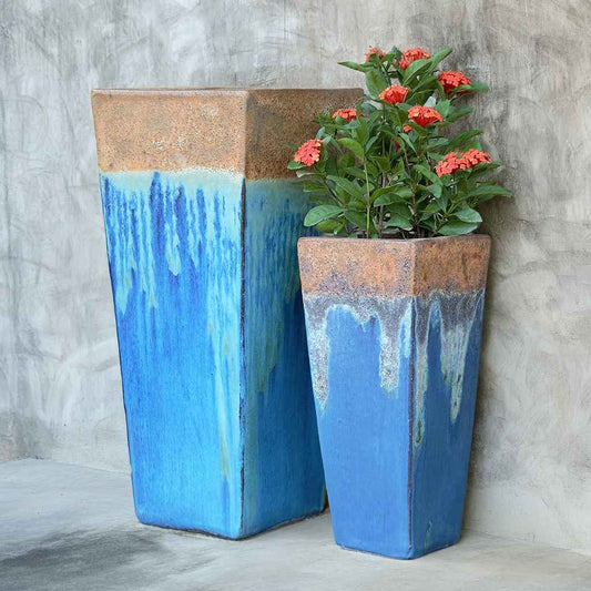 Rustic Angkor tapered planters with a textured, natural finish and subtle blue tones