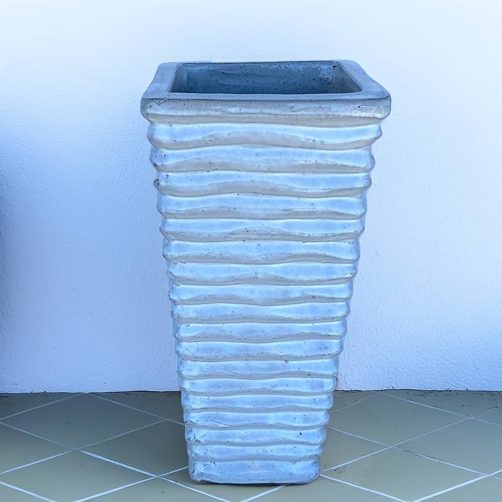 Tall, wavy ceramic planter in blue gray finish