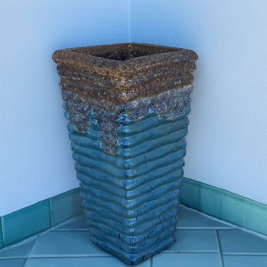 Wholesale tall square planter in blue with a ribbed texture and a contrasting rust-brown rim