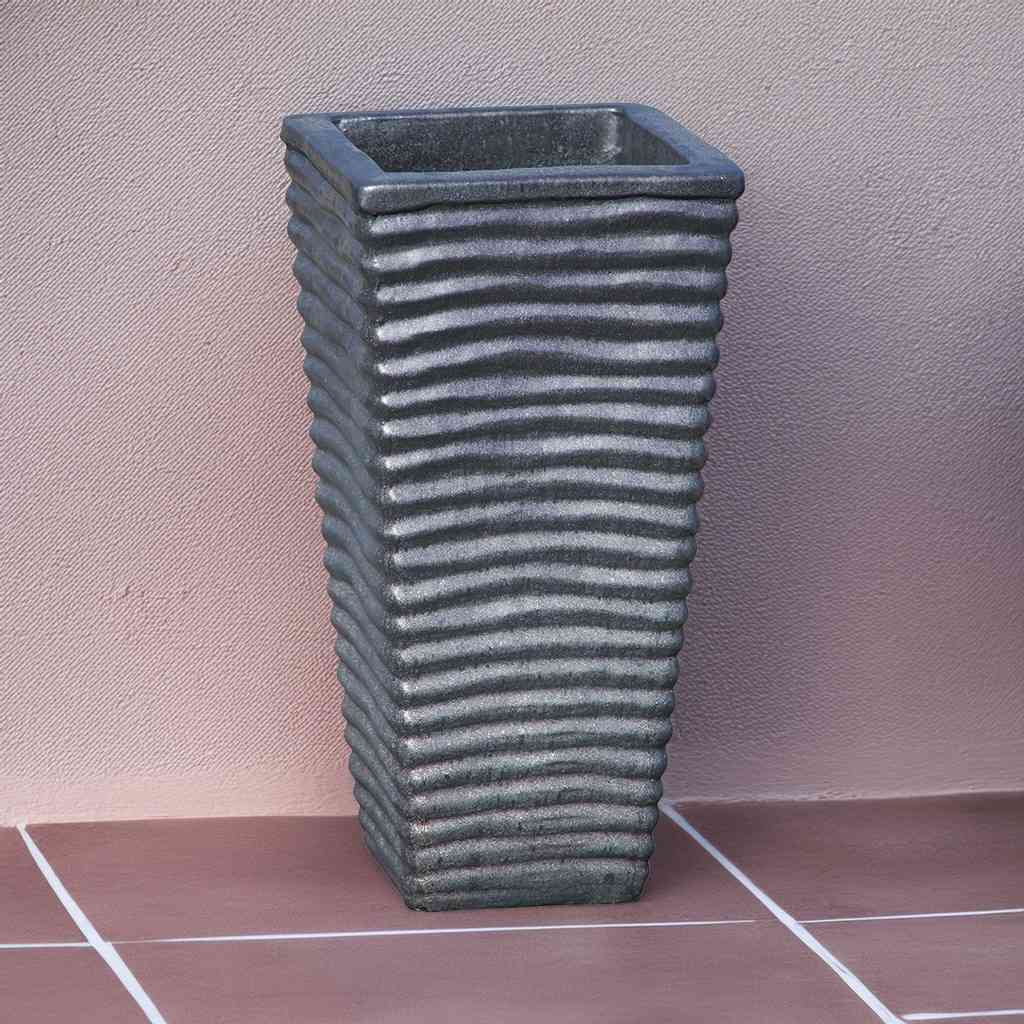 Tall, wavy ceramic planter in dark gray