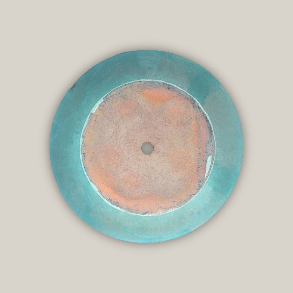Bottom view of cone-shaped ceramic low bowl planters in teal with wide rims and smooth finish