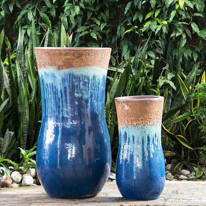 Hourglass-shaped ceramic planters with a drippy glaze effect in blue, light blue, and rust unglazed rim