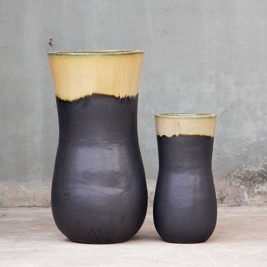 Dark matte ceramic planters with cream-colored glazed rim