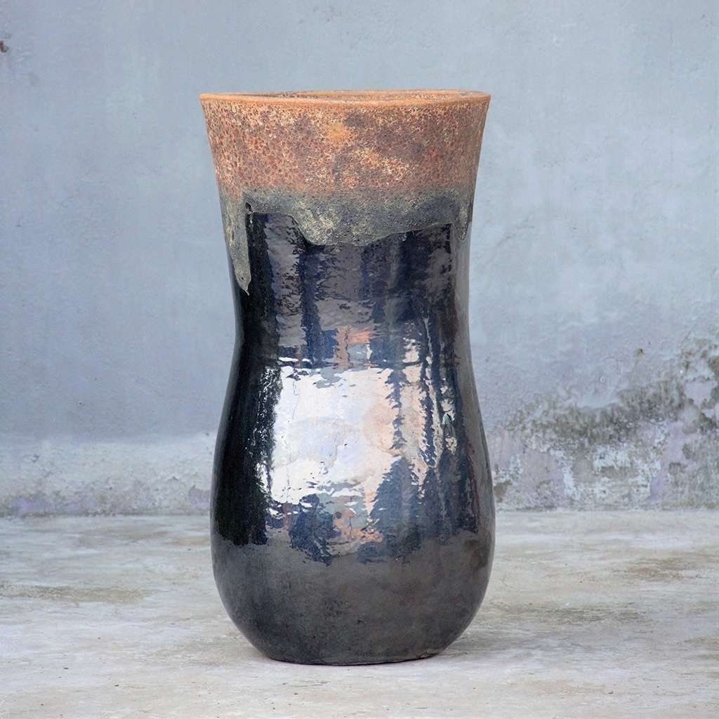 Glossy black ceramic planter with a rustic, unglazed rim