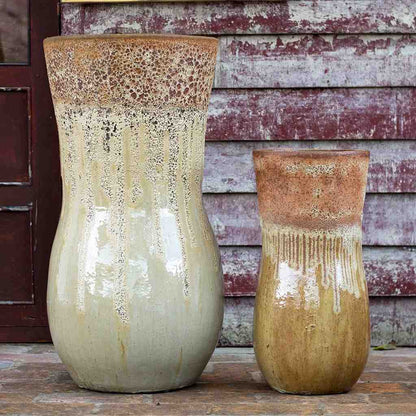 Two ceramic planters in earthy tones with rustic, unglazed rims for a natural, handcrafted feel