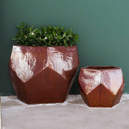 Faceted geometric polygon ceramic planter in cream with brown-red accents, featuring sharp angles and a modern design
