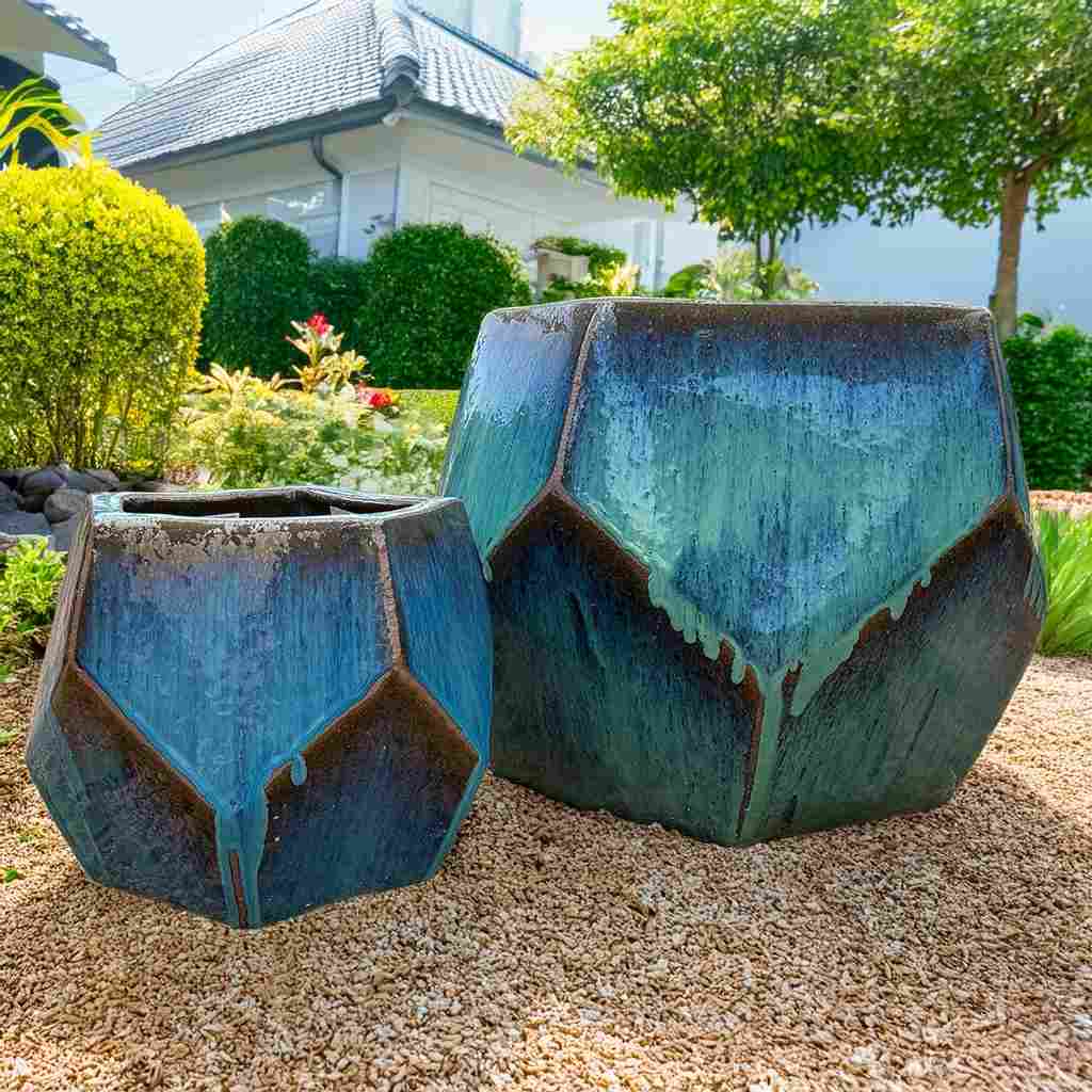 Faceted geometric polygon ceramic planter in turquoise with brown accents, featuring sharp angles and a modern design