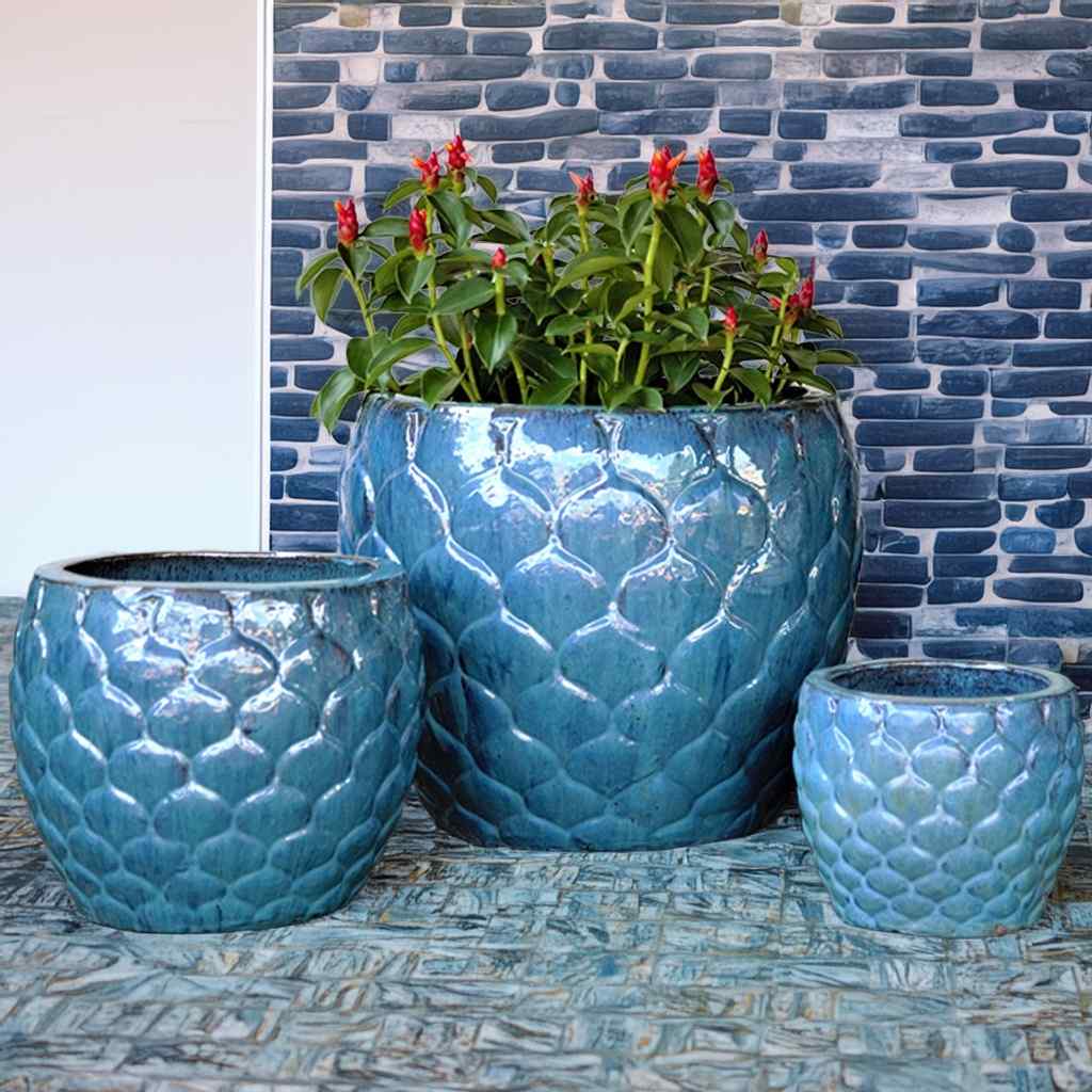 Opal green scalloped ceramic planter with a delicate, textured edge