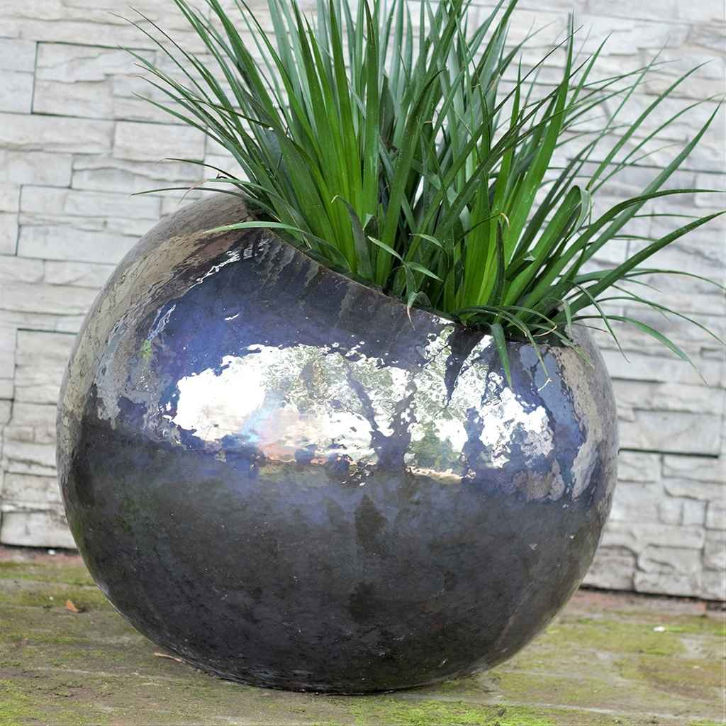 Glossy blue-gray tilted round ceramic planter with a smooth, modern finish