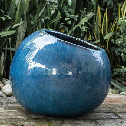 Wholesale  Tilted round ceramic planter with a glossy blue finish, featuring a unique angled design