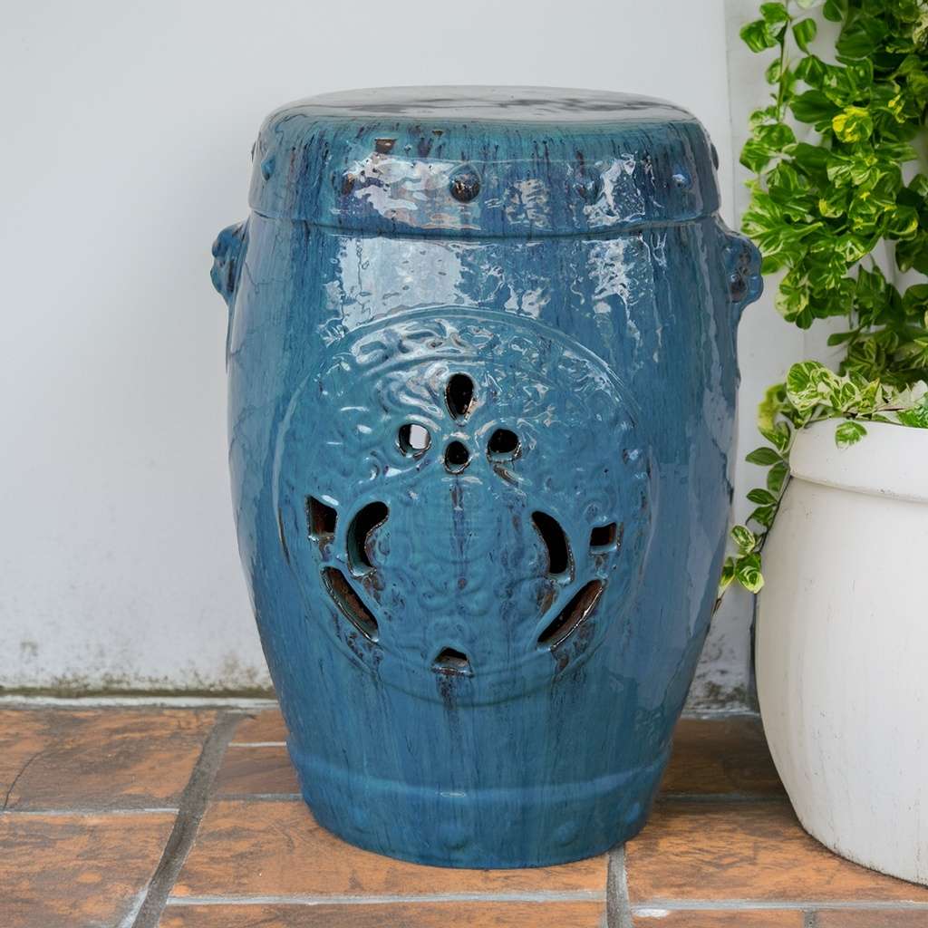 Wholesale Ornate ceramic garden stool in glazed blue, featuring intricate patterns and a glossy finish