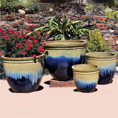 Classic rounded ceramic planter in dark blue with light blue and beige dripping glaze