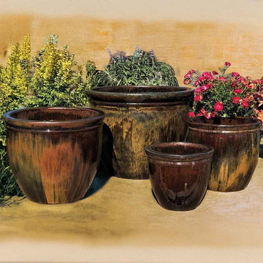 Classic rounded ceramic planter with a rich brown glazed finish, accented by subtle hints of moss green