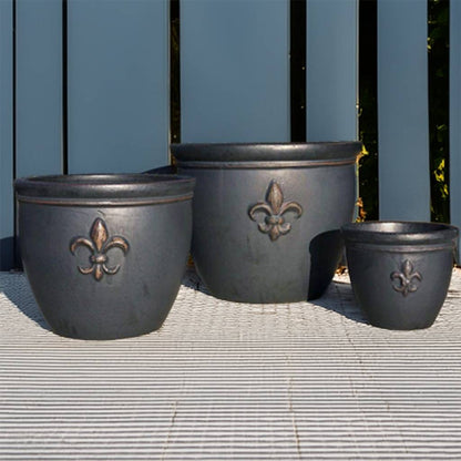 Wholesale round ceramic planters with elegant fleur-de-lis embossing in matte black