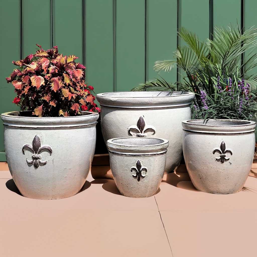 round ceramic planters with elegant fleur-de-lis embossing in glossy white