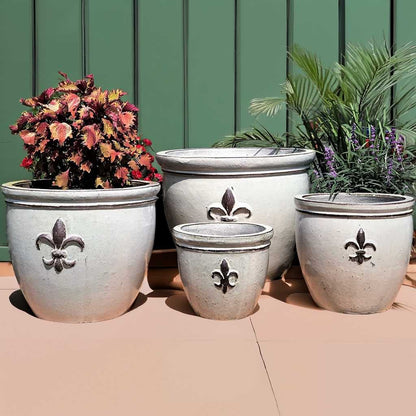round ceramic planters with elegant fleur-de-lis embossing in glossy white