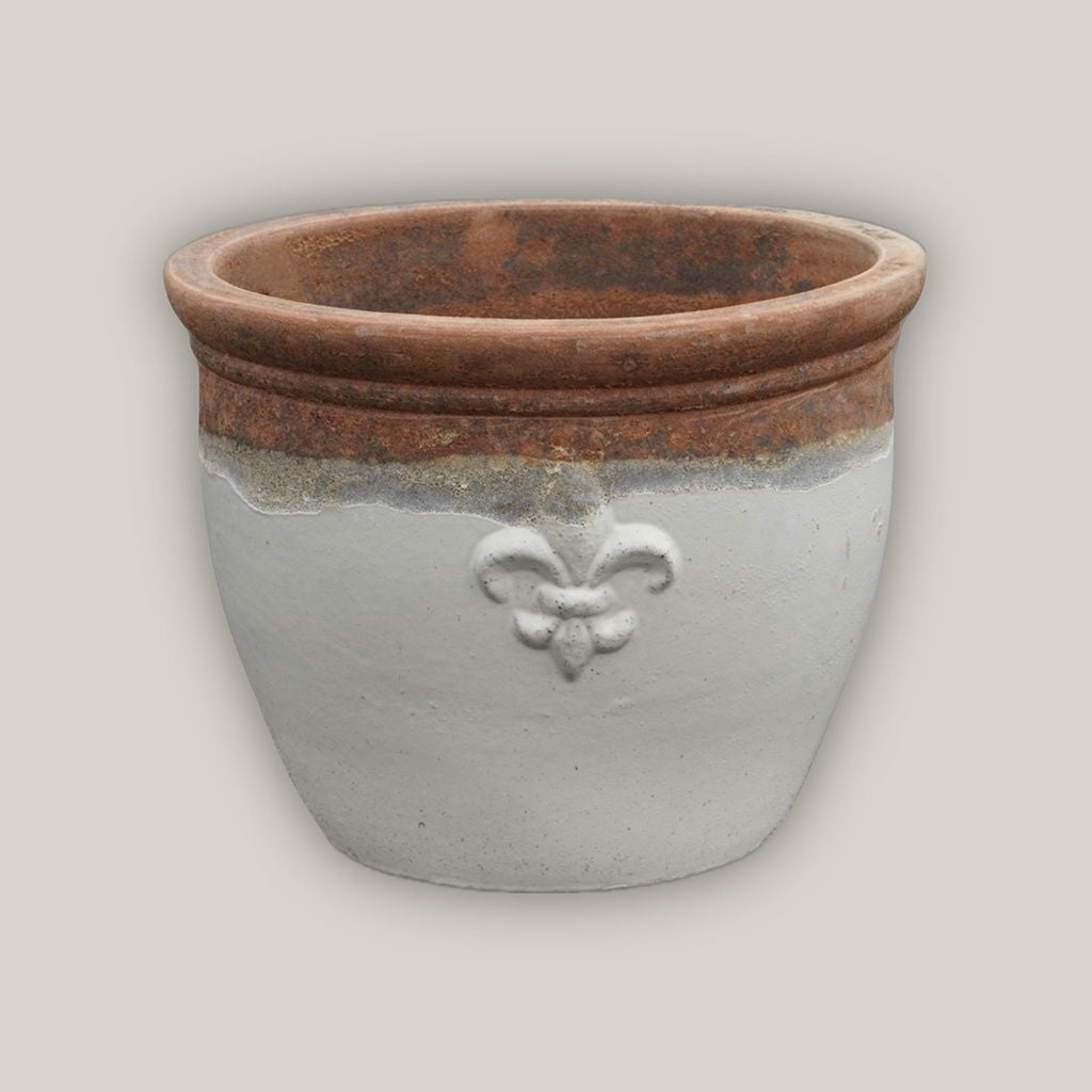 Round ceramic planter featuring elegant white fleur-de-lis embossing with a rustic, textured top