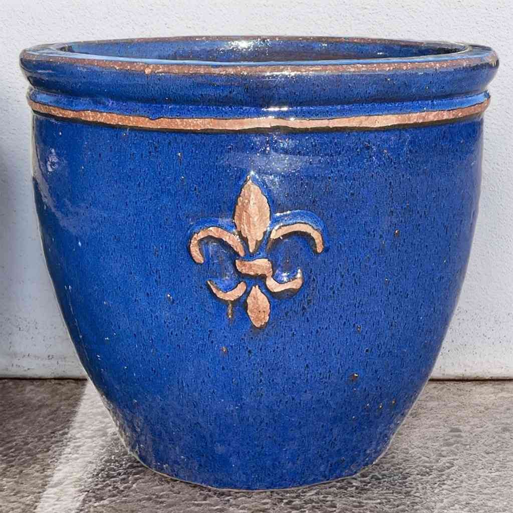 Round ceramic planter featuring elegant fleur-de-lis embossing and a glossy blue finish for a refined, classic touch