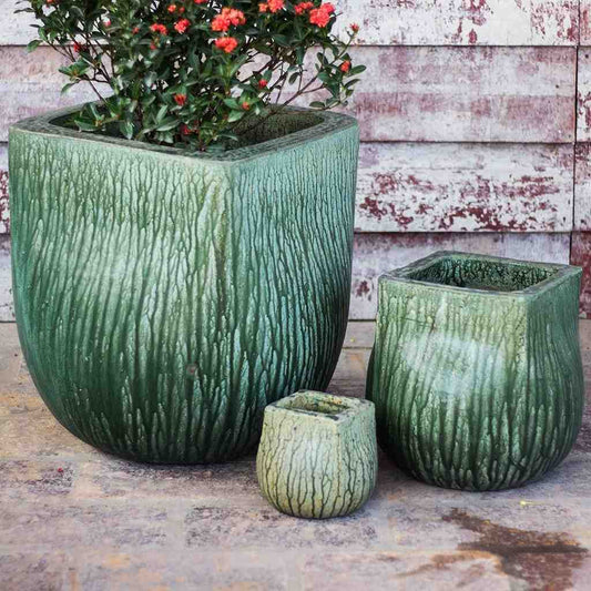 Bulk Grooved square planter in teal with a textured vertical stripe design, resembling wood root