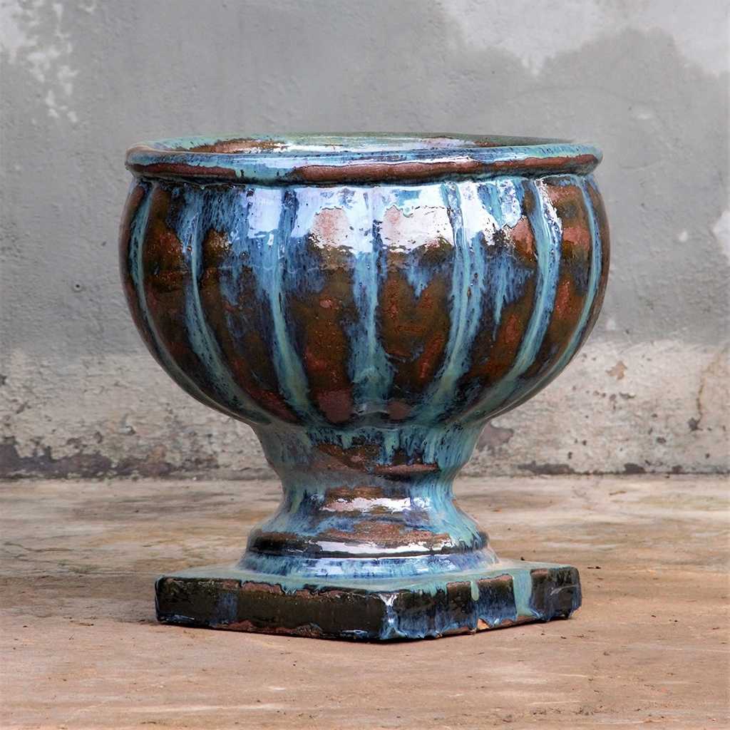Round pedestal pot in a rich copper green glaze for a warm, earthy elegance