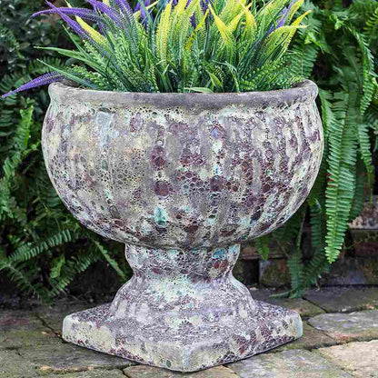 Round pedestal pot in a weathered Ocean Rock finish, evoking a natural, coastal-inspired look