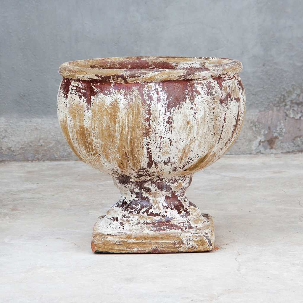 Round pedestal pot in distressed white with subtle reddish-brown undertones for a vintage, weathered look