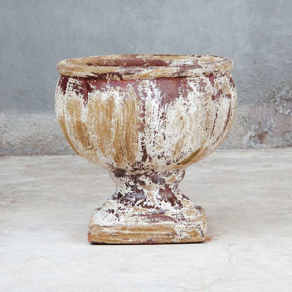 Round pedestal pot in distressed white with subtle reddish-brown undertones for a vintage, weathered look