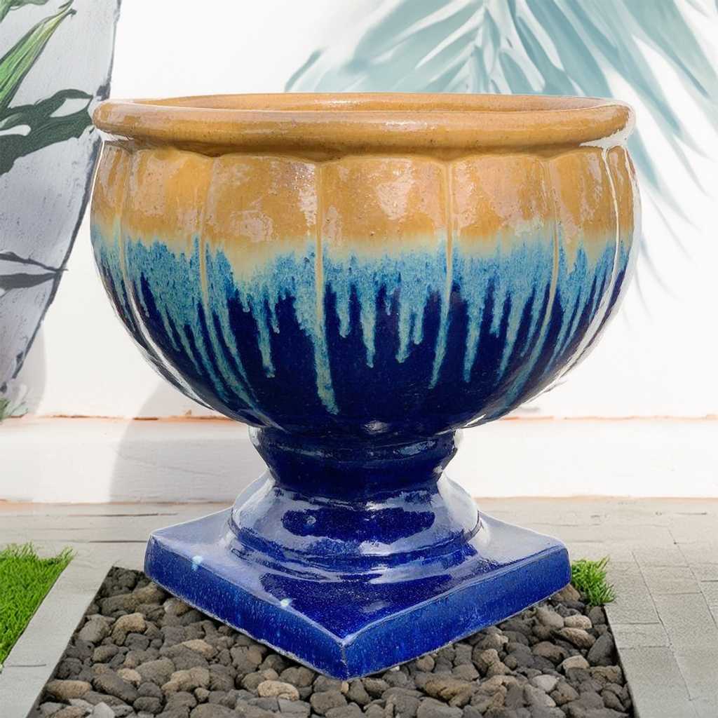 Round pedestal pot in blue with a dripping brown and gold glaze for a rich, artistic look