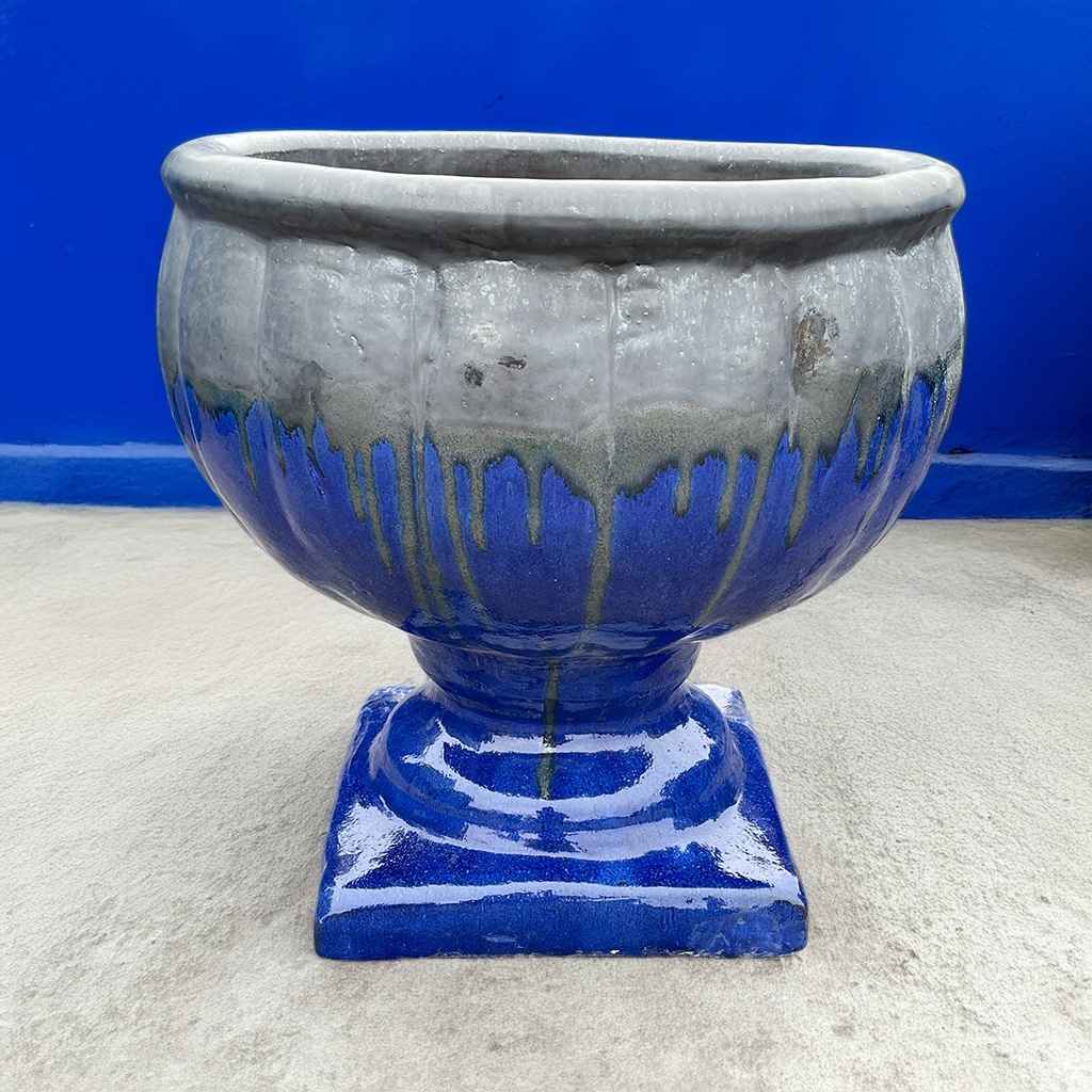 Round pedestal pot in blue with a dripping silver glaze for a bold, artistic effect