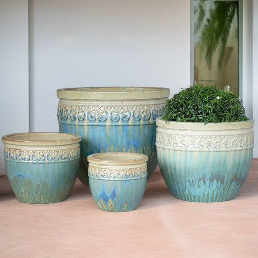 Wholesale Wide-mouth ceramic planters glazed in turquoise with a carved beige rim