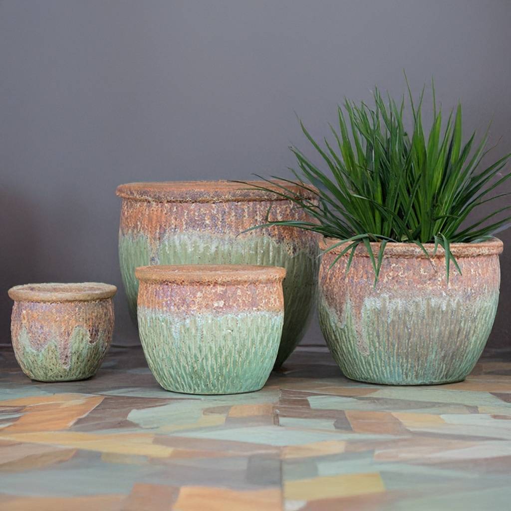 Rustic light green planter with a textured top