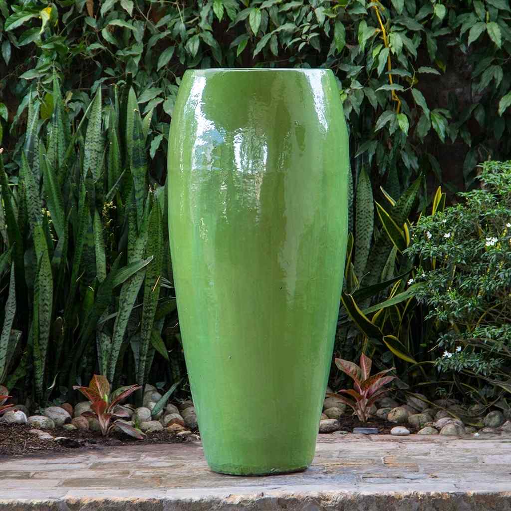 Tall tapered ceramic garden pot with a glossy green finish and smooth surface