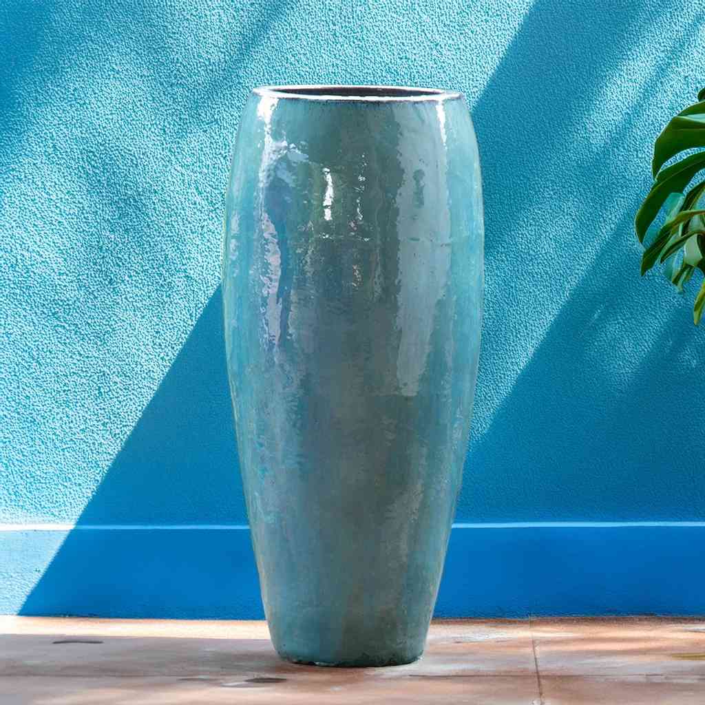 Tall tapered ceramic garden pot with a glossy aqua blue finish and smooth surface